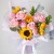 4朵昆明向日葵，8朵粉玫瑰，圆叶尤加利、栀子叶点缀，内衬粉色雾面纸四张，外围白色硬纱，白色丝带束扎。（保证与图片90%以上相似度），